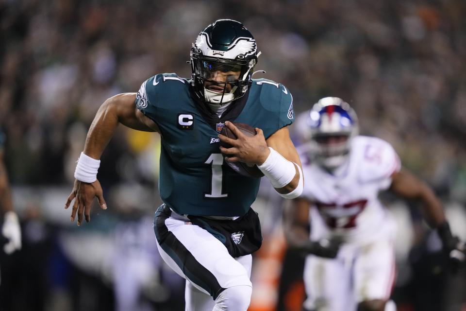 Philadelphia Eagles quarterback Jalen Hurts runs for a touchdown against the New York Giants during the first half of an NFL divisional round playoff football game, Saturday, Jan. 21, 2023, in Philadelphia. (AP Photo/Matt Rourke)