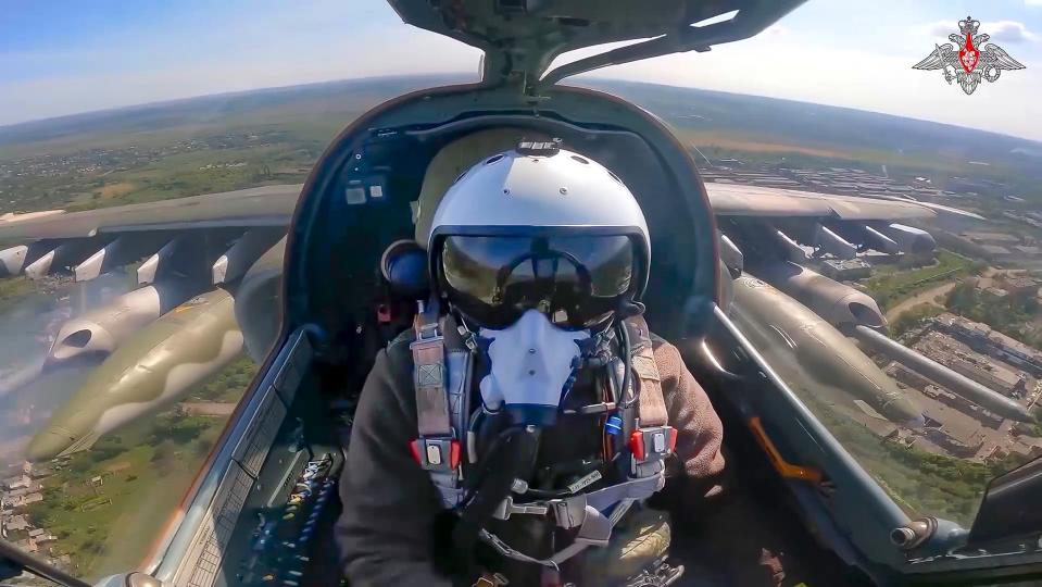 FILE - This photo, taken from video released by the Russian Defense Ministry Press Service on Wednesday, May 22, 2024, shows a Su-25 fighter jet firing rockets during a mission over Ukraine. Russian troops are forging through Ukraine's defenses along the front line of the battlefield in a relentless onslaught this summer, prompting the West to push for new weapons and strategies to shore up Kyiv. (Russian Defense Ministry Press Service via AP, File)