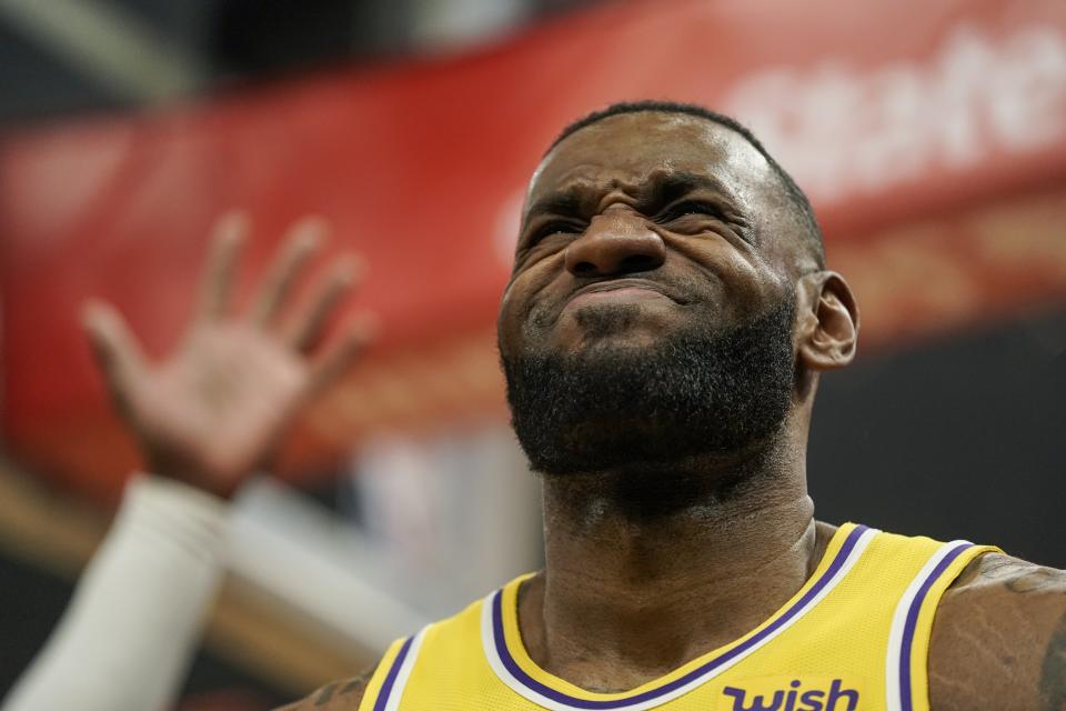 Los Angeles Lakers' LeBron James reacts to a call during the first half of an NBA basketball game against the Milwaukee Bucks Thursday, Dec. 19, 2019, in Milwaukee. (AP Photo/Morry Gash)