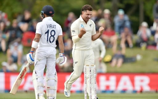 New Zealand's Colin de Grandhomme celebrates the prize wicket of India captain Virat Kohli