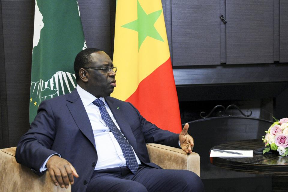 Senegalese President and the chairman of the African Union Macky Sall speaks to Russian President Vladimir Putin during their meeting in the Bocharov Ruchei residence in the Black Sea resort of Sochi, Russia, Friday, June 3, 2022. Putin hosted the chairman of the African Union, Senegal's President Macky Sall on Friday for talks expected to focus on how to get grain supplies stuck amid the fighting in Ukraine moving again. (Mikhail Klimentyev, Sputnik, Kremlin Pool Photo via AP)
