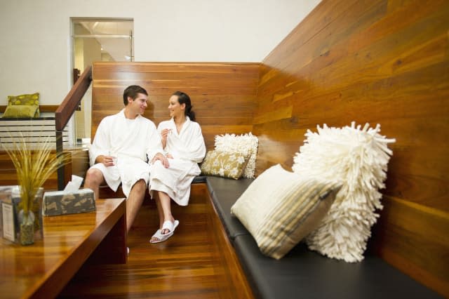 Couple in bathrobes relaxing in spa
