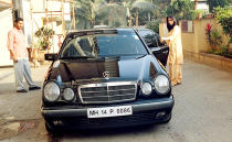 An old photo, we agree - but doesn't Manisha Koirala look proud of her Merc