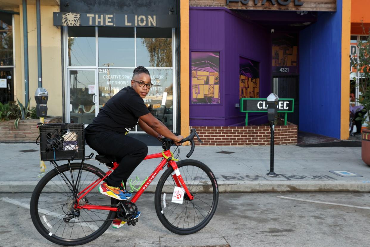 Lena Williams on their bike in Leimert Park in September 2020