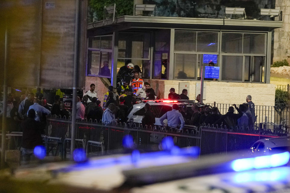 Israeli police officers and paramedics work at a border police checkpoint tower in Damascus Gate in Jerusalem's Old City, Sunday, May 8, 2022. A Palestinian man allegedly stabbed an Israeli police officer outside Jerusalem's Old City. Police said the knife-wielding man stabbed the policeman, and other officers at the scene near the Damascus Gate shot the assailant. Paramedics said the officer was hospitalized in moderate condition. The attacker's condition was not immediately clear. (AP Photo/Maya Alleruzzo)