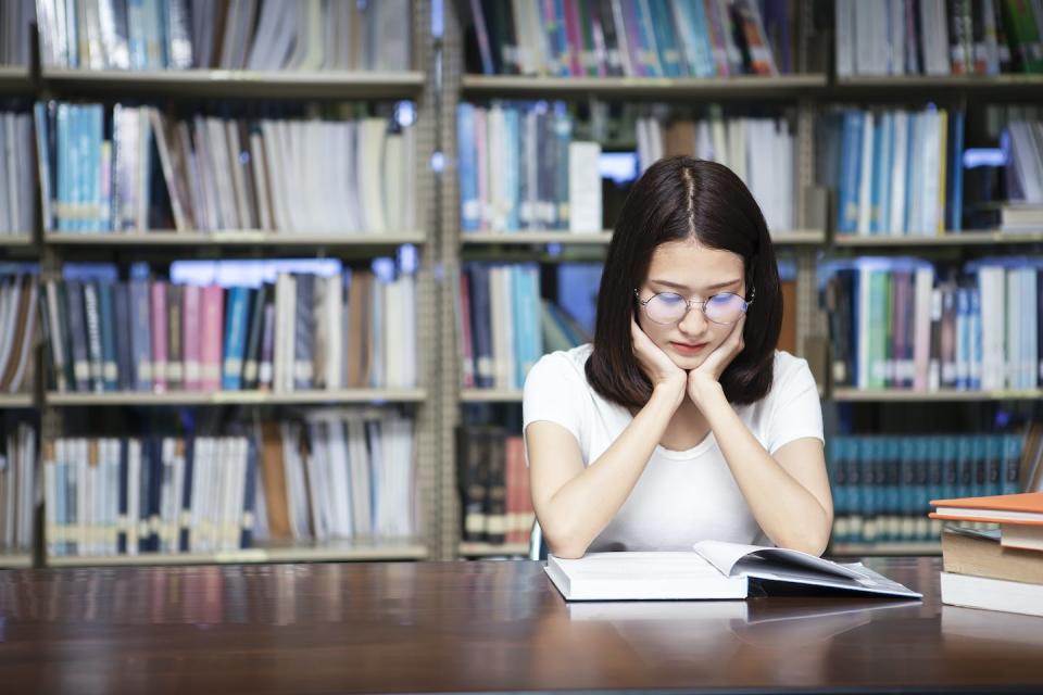 Research shows book banners often target stories by and about people of color and LGBTQ+ individuals. <a href="https://www.gettyimages.com/detail/photo/student-reading-a-book-in-library-royalty-free-image/951226090?phrase=textbooks+library&adppopup=true" rel="nofollow noopener" target="_blank" data-ylk="slk:kundoy/Moment via Getty Images;elm:context_link;itc:0;sec:content-canvas" class="link ">kundoy/Moment via Getty Images</a>