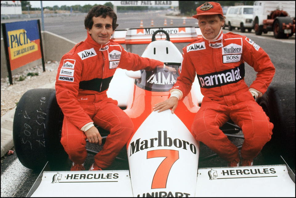 Lauda and teammate Alain Prost sat on the MacLaren they drove during the 1984 Formula One Championship, November 14th 1983. (Photo by GERARD FOUET/AFP/Getty Images)