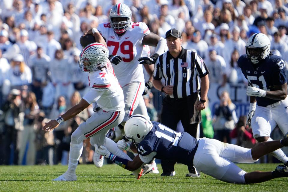 Oct 29, 2022; University Park, Pennsylvania, USA; Penn State Nittany Lions linebacker Abdul Carter (11) tackles Ohio State Buckeyes quarterback C.J. Stroud (7) during the first half of the NCAA Division I football game at Beaver Stadium. Mandatory Credit: Adam Cairns-The Columbus Dispatch