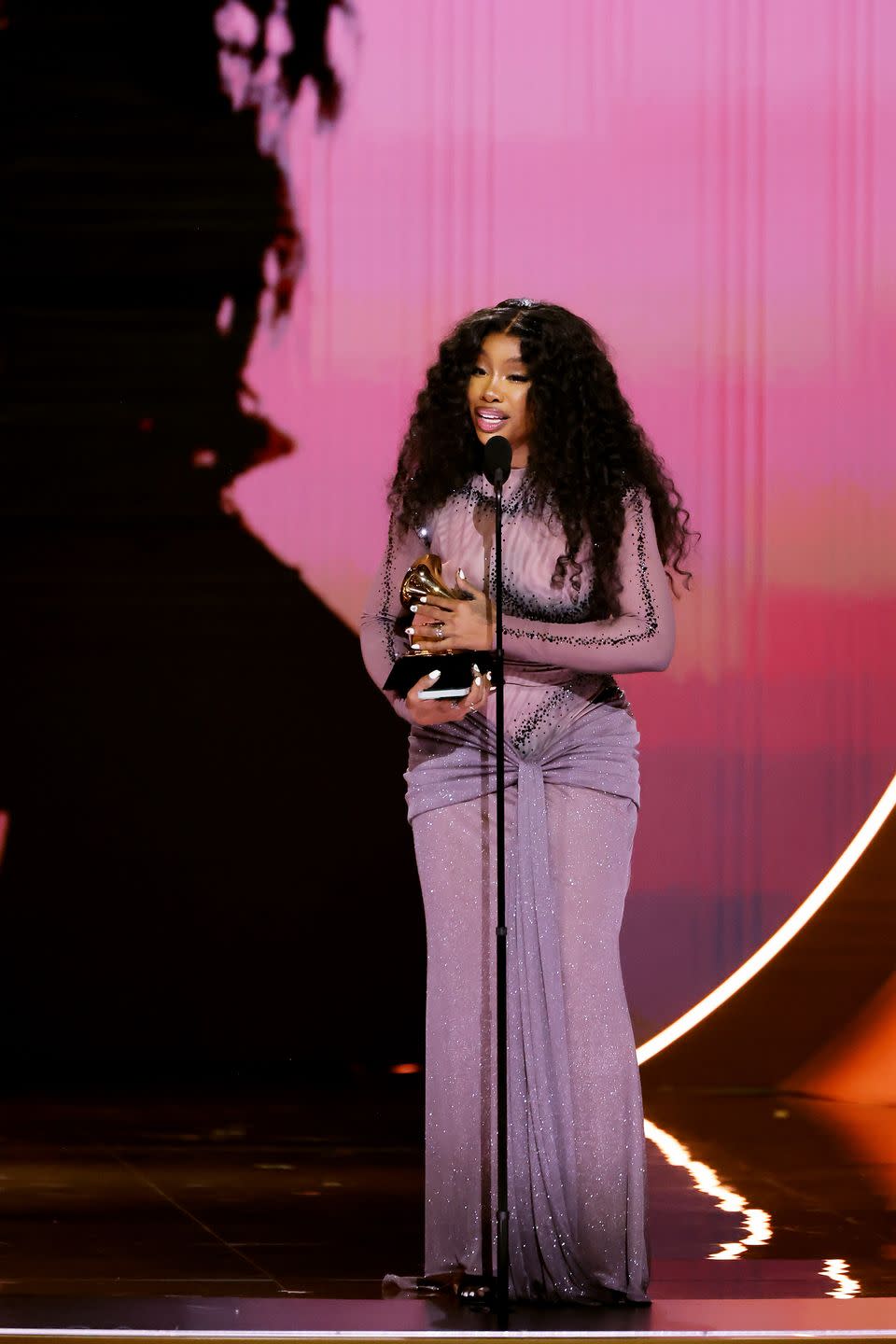 SZA Wore a transparent Bedazzled Optical Illusion Dress to Accept Her