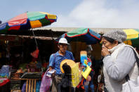 A street vendor sells his goods at Paradero 4 market, located near Nueva Union shantytown, in Villa Maria del Triunfo district of Lima, Peru, May 23, 2018. REUTERS/Mariana Bazo