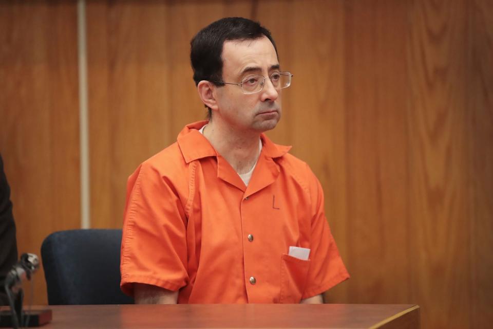 Larry Nassar sits in court listening to statements before being sentenced by Judge Janice Cunningham for three counts of criminal sexual assault in Eaton County Circuit Court on February 5, 2018 in Charlotte, Michigan. Nassar has been accused of sexually assaulting more than 150 girls and young women while he was a physician for USA Gymnastics and Michigan State University. Cunningham sentenced Nassar to 40 to 125 years in prison. He is currently serving a 60-year sentence in federal prison for possession of child pornography. Last month a judge in Ingham County, Michigan sentenced Nassar to an 40 to 175 years in prison after he plead guilty to sexually assaulting seven girls.