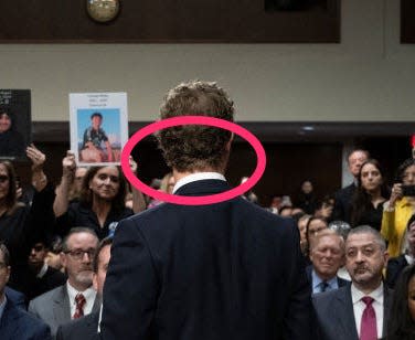 Mark Zuckerberg standing in front of audience