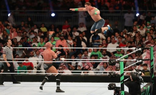 John Cena (R) competes with Triple H during the World Wrestling Entertainment (WWE) Greatest Royal Rumble event in the Saudi coastal city of Jeddah