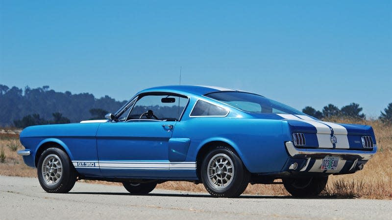 A photo of a pale blue Shelby Mustang. 