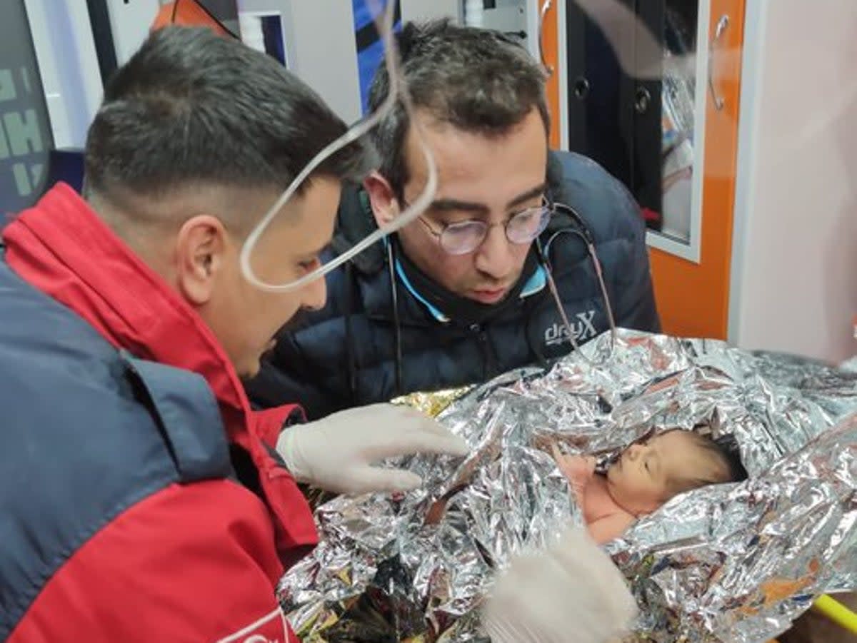 The 10-day-old boy, named Yagiz, was retrieved from a ruined structure in the southern Hatay province (Ekrem İmamoglu/Twitter)