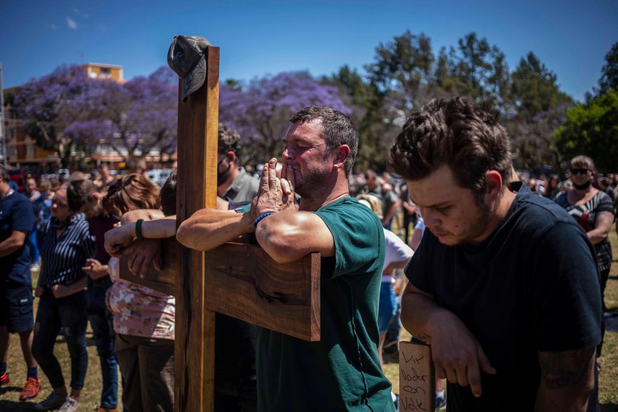 Farmers pray during a march to the Union Buildings calling for action to be taken against the high number of farmers murdered in Pretoria, South Africa.  (EPA)