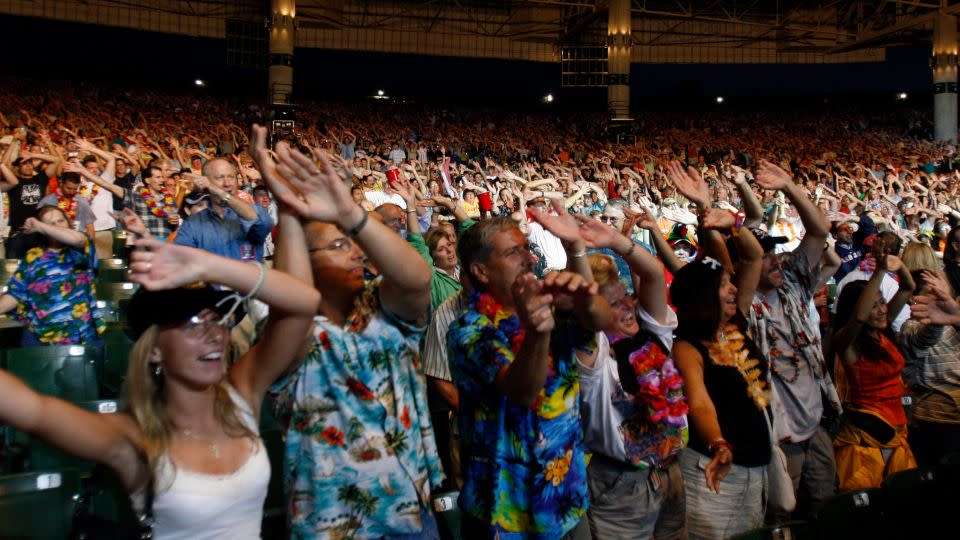 Buffet fans, affectionately known as "Parrot Heads," sway to the music at a sold-out concert in August 2006. - Robert E. Klein/AP