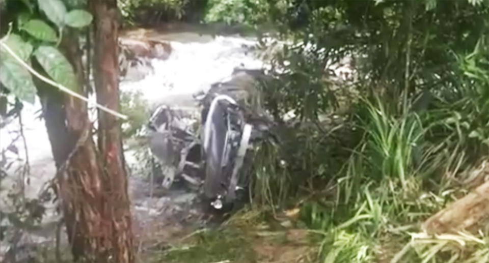 The car was found partially submerged in the Tully River south of cairns on Saturday afternoon. Source: 7 News