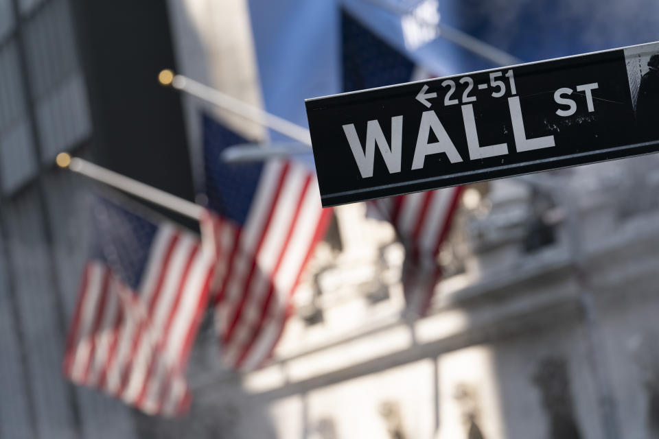 A sign for Wall Street hangs in front of the New York Stock Exchange, July 8, 2021. Stocks are edging lower on Wall Street in early trading Tuesday, Aug. 31, 2021 a day after the S&P 500 and the Nasdaq hit their latest record highs. The S&P 500 slipped 0.2% and the Nasdaq gave back 0.3%. Traders are keeping their eye on a final trickle of company earnings and looking ahead to Friday, when the Labor Department will release its monthly jobs report. (AP Photo/Mark Lennihan, file)