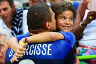 <p>France’s Daniel Narcisse kisses daughter Aimy after the men’s preliminary round handball match between Qatar and France.</p>