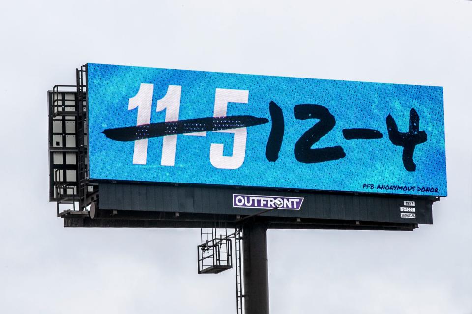 A billboard references a controversial referee call at the end of the recent Detroit Lions game against the Dallas Cowboys that cost the Lions the win near I-696 near John R. Road in Hazel Park, Mich., on Wednesday, Jan. 3, 2024.