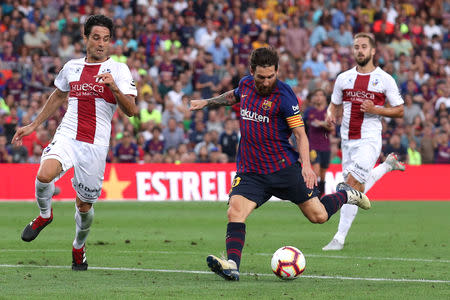 Soccer Football - La Liga Santander - FC Barcelona v SD Huesca - Camp Nou, Barcelona, Spain - September 2, 2018 Barcelona's Lionel Messi scores their sixth goal REUTERS/Albert Gea