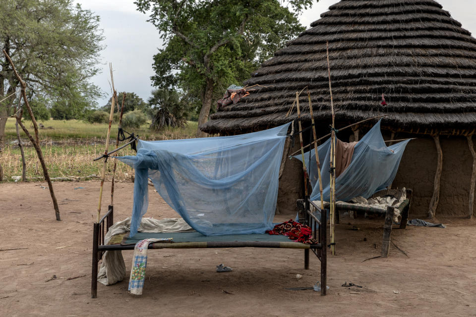 The shelter of Ajou Bol Yel is seen in Langic, Northern Bahr el Ghazal State, South Sudan, Wednesday, Oct. 20, 2021. Yel's family of seven hosted nine neighbors who had lost their homes in the floods. The elders sleep outside on beds protected by mosquito nets, while the children share the Tukul's floor. The United Nations says the flooding has affected almost a half-million people across South Sudan since May. (AP Photo/Adrienne Surprenant)