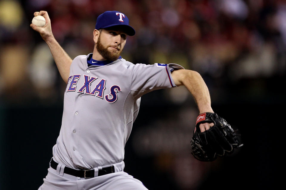 ST LOUIS, MO - OCTOBER 28: Scott Feldman #39 of the Texas Rangers pitches in the fifth inning during Game Seven of the MLB World Series against the St. Louis Cardinals at Busch Stadium on October 28, 2011 in St Louis, Missouri. (Photo by Ezra Shaw/Getty Images)