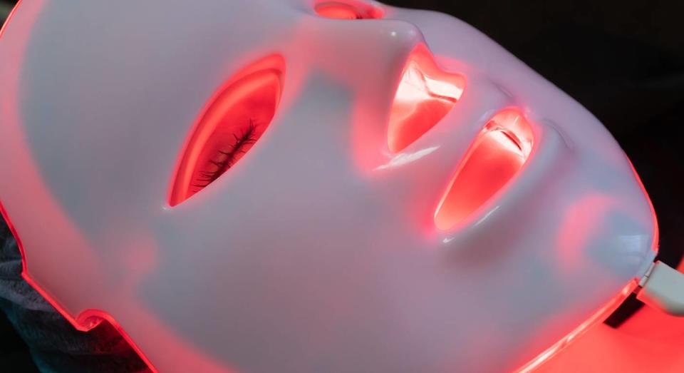 My LED light therapy mask is the best thing I've ever done for my skin. (Getty Images) 