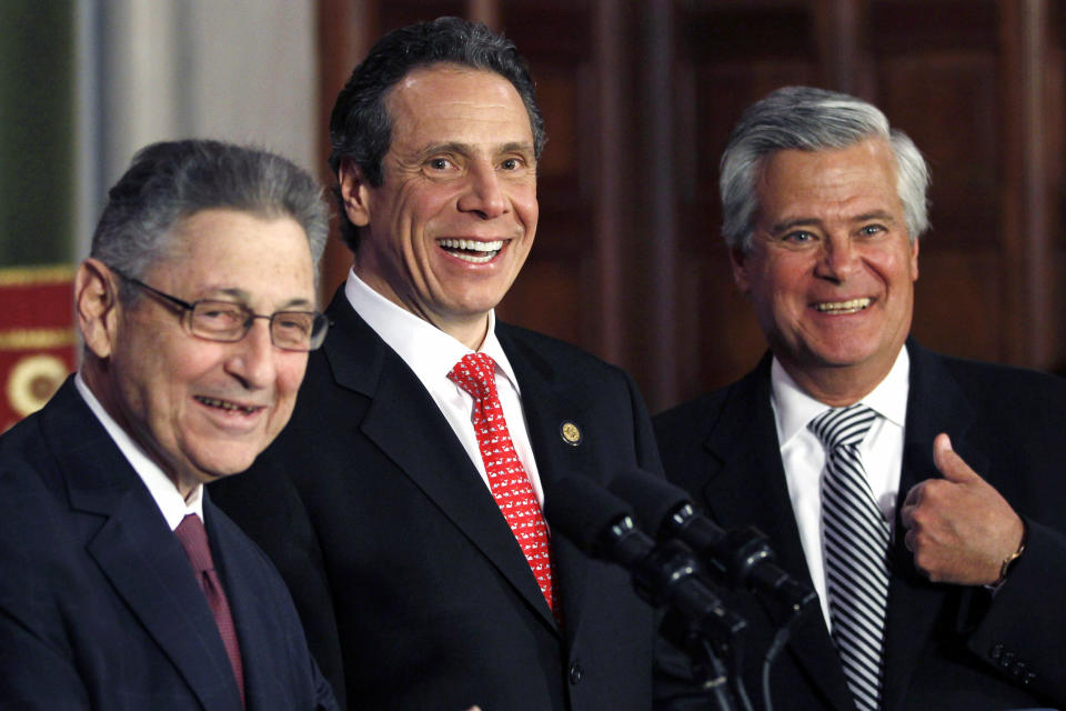 FILE - In this March 30, 2012 file photo, Assembly Speaker Sheldon Silver, D-Manhattan, left, Gov. Andrew Cuomo, center, and Senate Majority Leader Dean Skelos, R-Rockville Centre, laugh during a news conference at the Capitol in Albany, N.Y. Silver, one of the most powerful figures in state government for two decades before his conviction on corruption charges, died in federal custody on Monday, Jan. 24, 2022. He was 77. (AP Photo/Mike Groll, File)