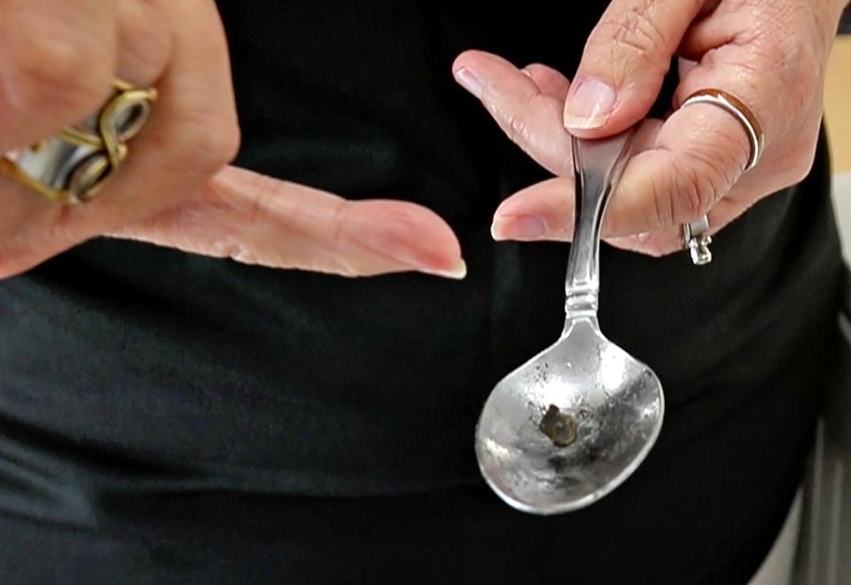 Carrie Padgett shows some of the signs of drug use in this mock teen bedroom used to teach about hidden drug use, Monday, July 22, 2019.  This spoon has charred remains from possible drug use. The RALI Care and Code 3 trailer is an educational tool for parents and families to help learn telltale signs of drug use.