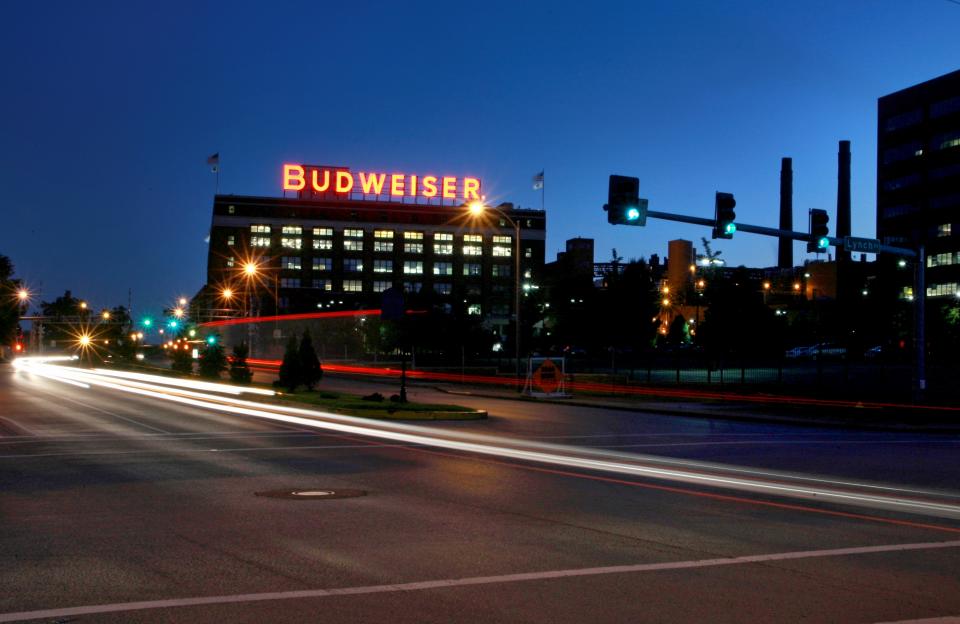 In this July 13, 2008 photo cars move near the Anheuser-Busch St. Louis brewery. August Busch III was CEO of Anheuser-Busch Companies for nearly three decades before his 2002 retirement, remaining as board chairman until 2006. The St. Louis brewer is being sued for gender discrimination by Francine Katz, who was the company’s highest ranking female executive before her 2008 resignation. Katz says she was grossly underpaid compared to her male predecessor and other top male executives at the company. (AP Photo/St. Louis Post-Dispatch, David Carson)