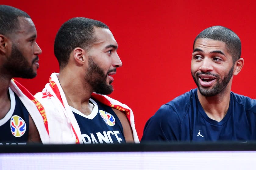 SHENZHEN, CHINA - SEPTEMBER 03: #5 Nicolas Batum(R), #27 Rudy Gobert and #2 Amath M'baye(L) of the France National Team