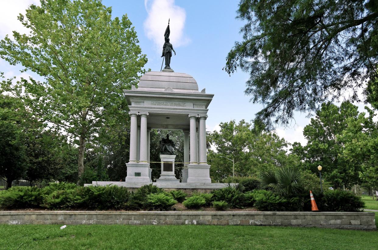 The u0022Tribute to the Women of the Southern Confederacyu0022 has stood since 1915 in Springfield Park. A statue on top of the roof shows a woman holding a partly-furled Confederate flag, and a statue inside the monument shows a woman reading to two children.