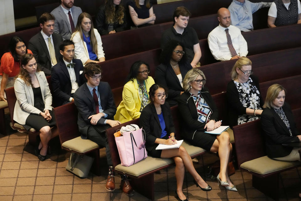 Spectators listen as attorneys debate before the Mississippi Supreme Court, the constitutionality of a Mississippi law that would authorize some judges who would be appointed in a state where most judges are elected, Thursday, July 6, 2023, in Jackson, Miss. (AP Photo/Rogelio V. Solis)