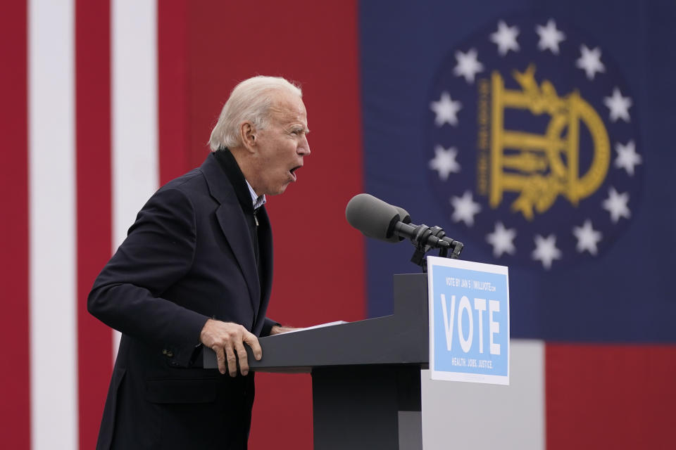 President-elect Joe Biden speaks at a drive-in rally for Georgia Democratic candidates for U.S. Senate Raphael Warnock and Jon Ossoff, Tuesday, Dec. 15, 2020, in Atlanta. (AP Photo/Patrick Semansky)