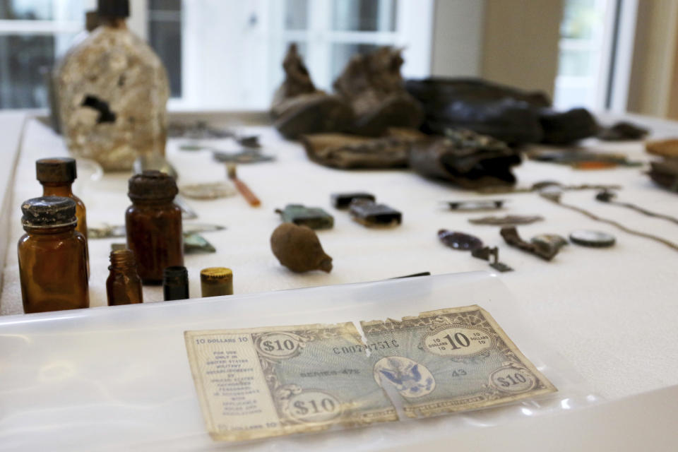 Artifacts from the Korean War are displayed at the U.S. Defense POW/MIA Accounting Agency Laboratory at Joint Base Pearl Harbor-Hickam, Hawaii on Tuesday, July 31, 2018. Human remains handed over to the U.S. government from North Korea are expected to arrive at the lab Wednesday where scientists will begin the process of trying to match the bones to American soldiers who didn't return from the Korean War. (AP Photo/Caleb Jones)