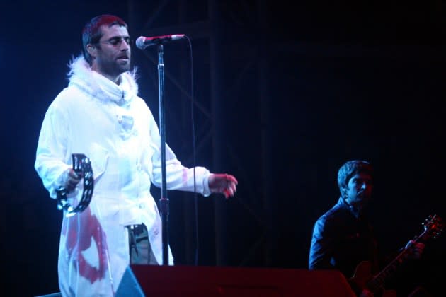 Liam Gallagher and Noel Gallagher of Oasis headlining Glastonbury in 2004. - Credit: Getty Images