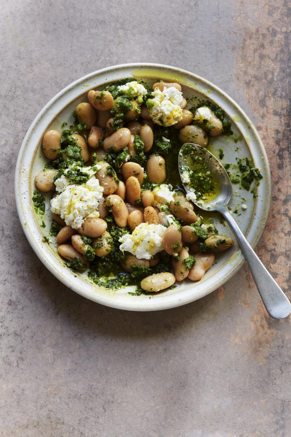 These ricotta and pesto butter beans make for a speedy weeknight dinner (Joe Woodhouse)