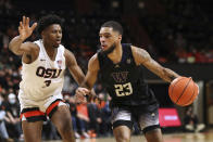 Washington's Terrell Brown Jr. (23) drives past Oregon State's Dexter Akanno (3) during the second half of an NCAA college basketball game Thursday, Jan. 20, 2022, in Corvallis, Ore. Washington won 82-72. (AP Photo/Amanda Loman)