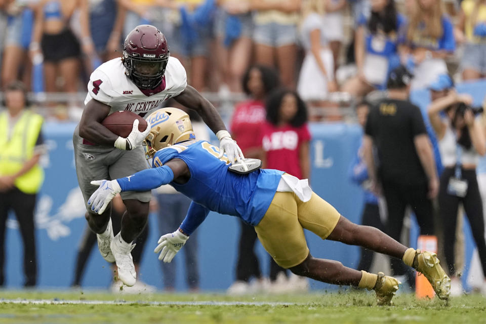 North Carolina Central running back J'Mari Taylor, left, is tackled by UCLA defensive back Jordan Anderson during the first half of an NCAA college football game Saturday, Sept. 16, 2023, in Pasadena, Calif. (AP Photo/Mark J. Terrill)