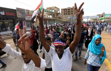 People demonstrate against the killing of protesting children, who were shot dead when security forces broke up a student protest in Khartoum