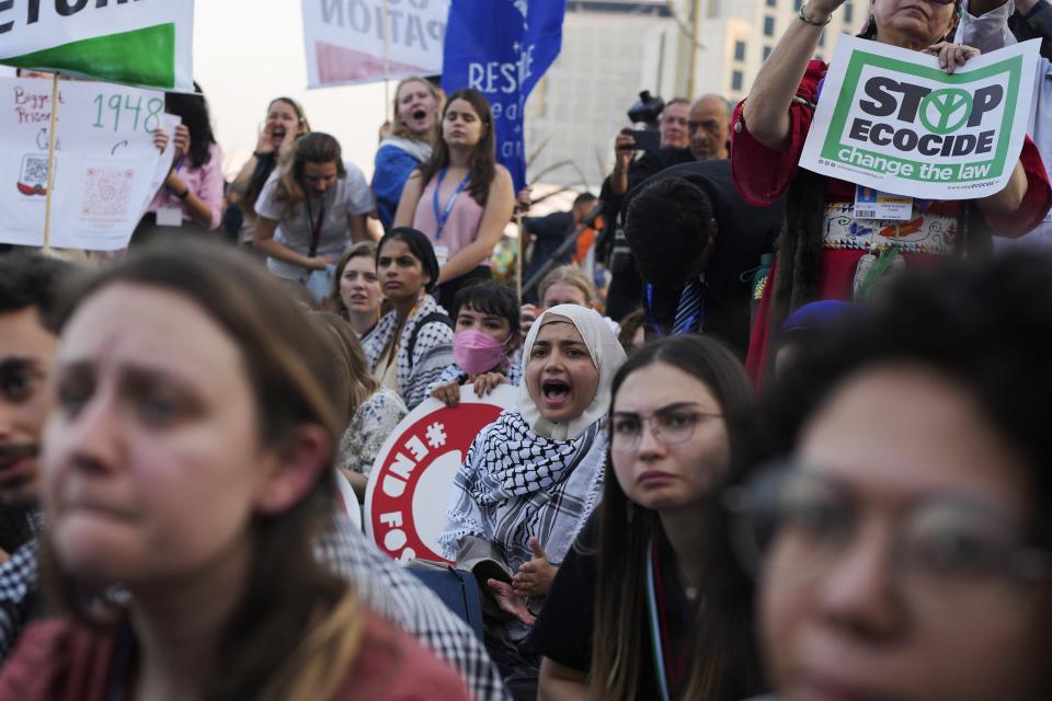 Activists demonstrate for climate justice and a ceasefire in the Israel-Hamas war at the COP28 U.N. Climate Summit, Saturday, Dec. 9, 2023, in Dubai, United Arab Emirates. (AP Photo/Rafiq Maqbool)