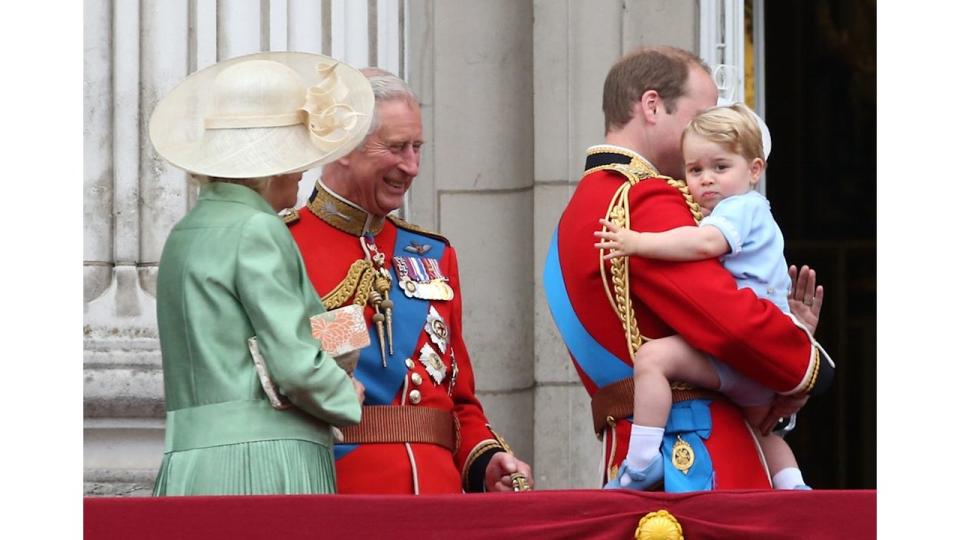 Camilla and Charles look at Prince George as they stand on the balcony of Buckingham Palace during the annual Trooping The Colour ceremony at Horse Guards Parade in 2015