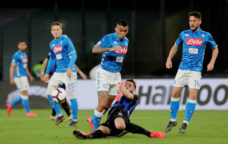 Soccer Football - Serie A - Napoli v Inter Milan - Stadio San Paolo, Naples, Italy - May 19, 2019 Napoli's Allan in action with Inter Milan's Roberto Gagliardini as Napoli's Dries Mertens looks on REUTERS/Ciro De Luca