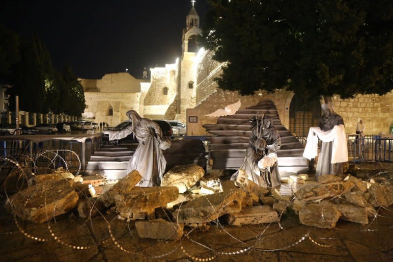 A nativity scene surrounded by rubble and barbed wire replaces the traditional Christmas Tree at Manger Square in Bethlehem on Sunday. Photo courtesy of the Bethlehem Municipality/Facebook