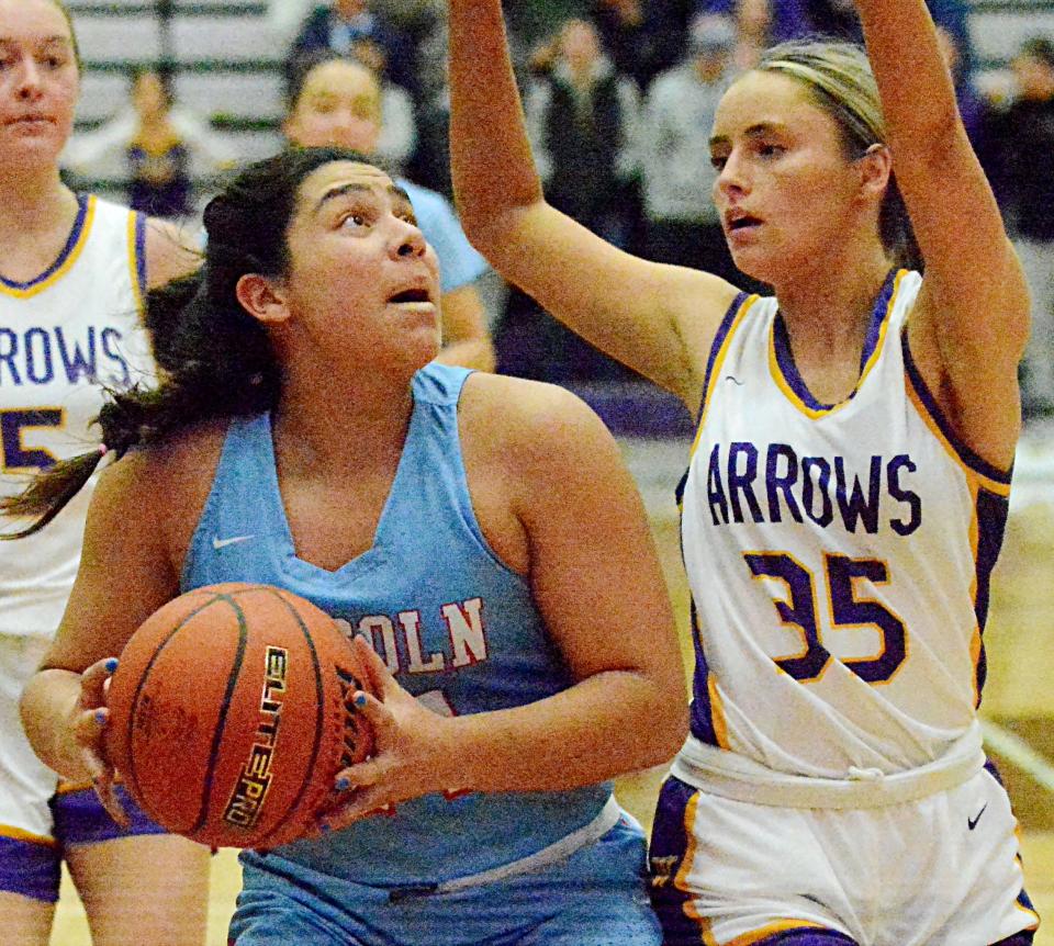 Watertown's Kendall Paulson (35) defends against Sioux Falls Lincoln's Kierra Lubovich during their high school girls basketball game on Tuesday, Jan. 31, 2023 in the Watertown Civic Arena.