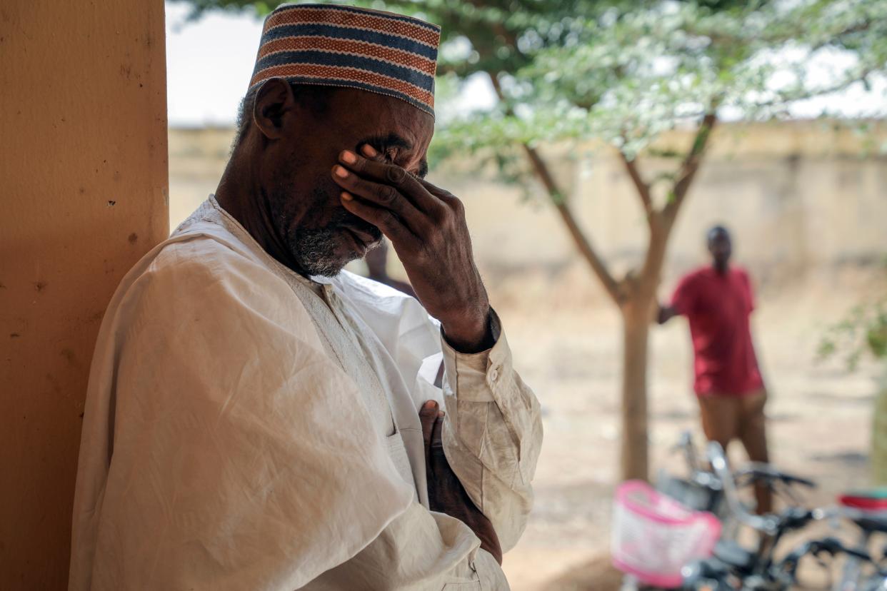 <p>Father Aliyu Ladan Jangebe, whose four daughters are among more than 300 girls who were abducted by gunmen on Friday from the Government Girls Junior Secondary School, waits for news</p> (Copyright 2021 The Associated Press. All rights reserved.)