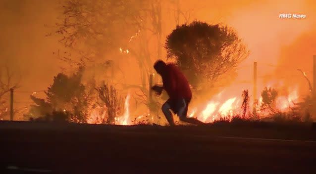 As the rabbit runs back out, the man manages to catch it. Photo: RMG News