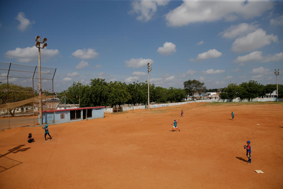 Players from Cacique Mara little league baseball team practice during training at Cacique Mara stadium in Maracaibo, Venezuela. (Photo: Manaure Quintero/Reuters)